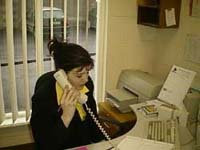 Trainee answering the phone ask part of a clerical work