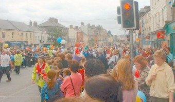 Crowds Line the Streets as The Olympic Torch Passes